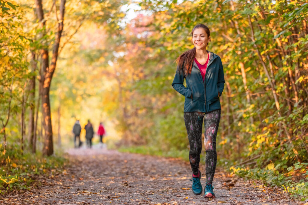 Women walking on trail at the end of summer