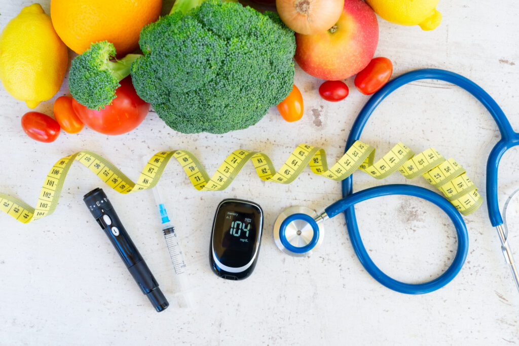 Healthy foods, glucose meter, and medical tools illustrating diabetes symptoms and prevention